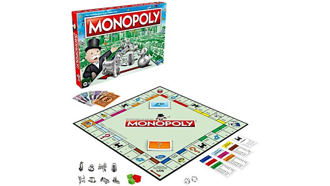 Gezeigt wird die Schachtel, das Spielbrett und Spielmaterial des Brettspiels Monopoly Klassik.